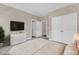 Cozy bedroom boasts a large wardrobe, neutral decor, and comfortable furnishings for a restful ambiance at 208 Bridle Boast Rd, Cary, NC 27519