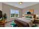 Well-decorated bedroom features a comfy bed, vibrant decor, and scenic window views at 208 Bridle Boast Rd, Cary, NC 27519