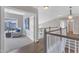 Second floor hallway featuring hardwood floors and an open doorway to a sitting room at 208 Bridle Boast Rd, Cary, NC 27519