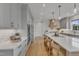 Bright kitchen with light gray cabinets, a large island, and stainless steel appliances at 208 Bridle Boast Rd, Cary, NC 27519