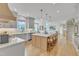 A spacious kitchen features a large island with seating and stylish gray cabinets at 208 Bridle Boast Rd, Cary, NC 27519