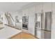 Kitchen features an island, white cabinets, and stainless steel appliances at 208 Bridle Boast Rd, Cary, NC 27519