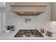 The kitchen features stainless steel appliances, a modern gas cooktop, and stylish backsplash at 208 Bridle Boast Rd, Cary, NC 27519