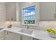 A well-lit kitchen area features a sink with a view, light cabinets, and tasteful backsplash at 208 Bridle Boast Rd, Cary, NC 27519
