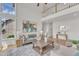 Bright living room with tall windows, comfortable seating, and view of the balcony above at 208 Bridle Boast Rd, Cary, NC 27519