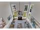 Bright living room with fireplace, large windows, high ceilings, and stylish decor at 208 Bridle Boast Rd, Cary, NC 27519