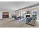 Open-concept living room with fireplace, dining area, and comfortable seating for gatherings at 208 Bridle Boast Rd, Cary, NC 27519
