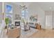 Bright, airy living room with a fireplace, large windows, comfortable seating, and stylish decor at 208 Bridle Boast Rd, Cary, NC 27519