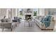 Beautifully furnished living area with a fireplace, stylish decor, and plenty of natural light at 208 Bridle Boast Rd, Cary, NC 27519
