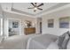 View of bedroom showing ensuite entrance, and walk-in closet. Large windows provide natural light at 208 Bridle Boast Rd, Cary, NC 27519