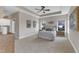 Spacious main bedroom with neutral colors, tray ceilings, and large windows at 208 Bridle Boast Rd, Cary, NC 27519