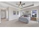 A spacious bedroom features a tray ceiling, plush carpet, and dual windows for ample natural light at 208 Bridle Boast Rd, Cary, NC 27519