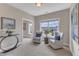 Comfortable sitting room with two chairs, side tables and lots of natural light at 208 Bridle Boast Rd, Cary, NC 27519