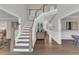 Welcoming foyer with hardwood floors and staircase leading to the upper level at 208 Bridle Boast Rd, Cary, NC 27519