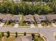 An aerial view of a residential neighborhood featuring well-maintained homes and lush landscaping at 211 Ibis Ln, Durham, NC 27703