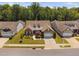 Aerial view of home, showcasing the surrounding neighborhood and mature trees at 211 Ibis Ln, Durham, NC 27703