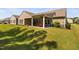 Spacious backyard with a covered patio, ideal for outdoor relaxation and entertaining at 211 Ibis Ln, Durham, NC 27703