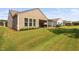 Expansive backyard with a covered patio and well-maintained lawn, perfect for outdoor enjoyment at 211 Ibis Ln, Durham, NC 27703