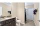 A bathroom with a granite sink and faucet plus a view of the toilet and shower at 211 Ibis Ln, Durham, NC 27703