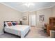 Bedroom featuring a comfortable bed and a dedicated workspace with a desk at 211 Ibis Ln, Durham, NC 27703