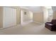Spacious bonus room with neutral carpet, storage closet, and a comfortable sitting area at 211 Ibis Ln, Durham, NC 27703