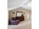 Loft space with an accent chair and ample storage at 211 Ibis Ln, Durham, NC 27703