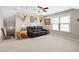 Bright bonus room featuring a window, recessed lights, and comfortable leather sofa seating at 211 Ibis Ln, Durham, NC 27703