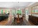 Formal dining room with wood floors, chandelier, and views of the backyard at 211 Ibis Ln, Durham, NC 27703