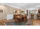 Formal dining room features wood floors, chandelier, and paneled walls at 211 Ibis Ln, Durham, NC 27703