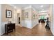 Inviting foyer with wood floors, paneled walls, and stylish decor at 211 Ibis Ln, Durham, NC 27703