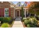 Inviting front porch with classic details and lush landscaping at 211 Ibis Ln, Durham, NC 27703