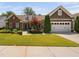 Charming single Gathering home featuring a well-manicured lawn and mature landscaping at 211 Ibis Ln, Durham, NC 27703