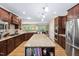 Spacious kitchen with a large center island, stainless appliances, and granite counters at 211 Ibis Ln, Durham, NC 27703