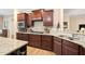 Kitchen featuring granite countertops, stainless steel appliances, and custom cabinetry at 211 Ibis Ln, Durham, NC 27703