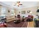 Comfortable living room featuring a ceiling fan, a side table, and a patterned rug at 211 Ibis Ln, Durham, NC 27703