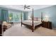 Serene main bedroom with four poster bed, soft colors, and plenty of natural light at 211 Ibis Ln, Durham, NC 27703