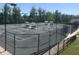 Community tennis courts with benches and lights are available for residents to enjoy at 211 Ibis Ln, Durham, NC 27703