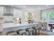 Modern kitchen with quartz countertops, an island with seating, and stainless steel appliances at 215 Blue Butterfly Dr, Angier, NC 27501