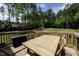 Outdoor dining set is on the back deck, with railings and a grill nearby at 220 Purslane Dr, Franklinton, NC 27525