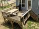 View of an outdoor dining set on the wooden back deck of the home at 220 Purslane Dr, Franklinton, NC 27525