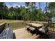 Relax on the back deck with outdoor seating and enjoy a treelined view at 220 Purslane Dr, Franklinton, NC 27525