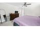 Cozy bedroom featuring a ceiling fan, dresser, decor, mirror and carpet at 220 Purslane Dr, Franklinton, NC 27525