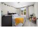 Inviting bedroom featuring a cozy bed, large window, carpet and desk at 220 Purslane Dr, Franklinton, NC 27525