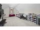 Spacious bonus room featuring a comfortable seating area, built in bookshelves and natural light at 220 Purslane Dr, Franklinton, NC 27525