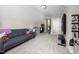 A bonus room is carpeted and has a gray sofa, and a workout machine at 220 Purslane Dr, Franklinton, NC 27525
