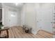 Inviting entryway with hardwood floors, a bench, and closet doors, creating a welcoming space at 220 Purslane Dr, Franklinton, NC 27525
