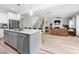 Open concept kitchen with stainless steel appliances and an island with barstool seating at 220 Purslane Dr, Franklinton, NC 27525