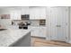 Stylish kitchen featuring white cabinets, granite countertops and stainless steel appliances at 220 Purslane Dr, Franklinton, NC 27525