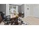 Well lit office space with large window, desk, stylish decor, and a view of the neighborhood at 220 Purslane Dr, Franklinton, NC 27525