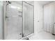 Luxurious walk-in shower featuring a glass enclosure, window and tiled walls at 220 Purslane Dr, Franklinton, NC 27525